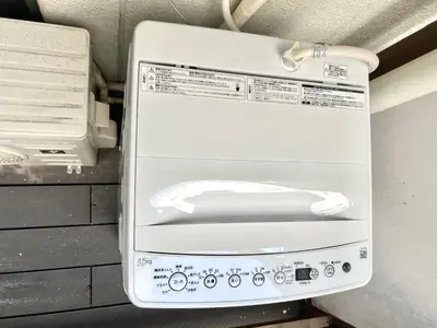 a white machine sitting on top of a wall at shinjuku yichun hostel-SJ0399 in Tokyo