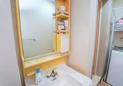 a bathroom with a sink and a mirror at 9th floor Elevator Yamanote Line Komagome Station 3 mins walk 3 rooms 1 room 1 room Direct access to Shinjuku Ueno Akihabara Ginza Tokyo Ikebukuro Shinjuku Shibu in Tokyo