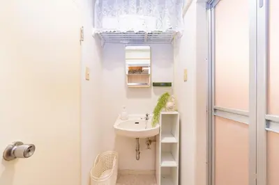 a small bathroom with a sink and a shower at Stay in the most popular city for young people in Japan in Tokyo