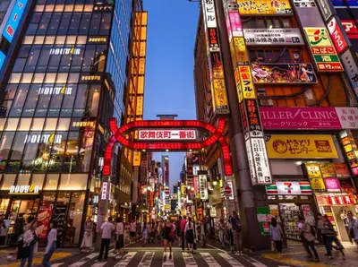 a busy city street with people crossing the street at Stay in the most popular city for young people in Japan in Tokyo