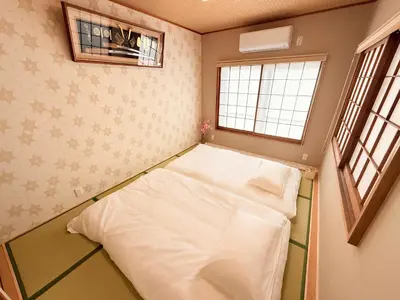 a small room with a bed in the corner at \u98a8\u82b1Fuka\u6c11\u6cca\u5927\u68ee\u897f001 in Tokyo