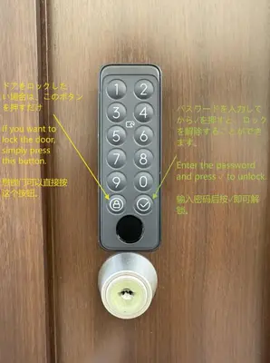 a remote control is attached to a wooden door at \u98a8\u82b1Fuka\u6c11\u6cca\u5927\u68ee\u897f001 in Tokyo