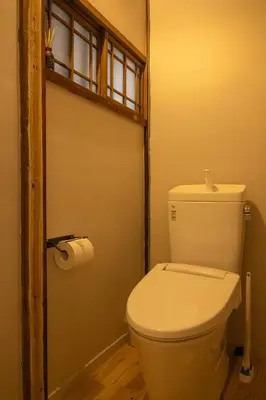 a bathroom with a white toilet and a window at Roopt\u795e\u697d\u5742 in Tokyo