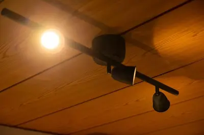 a ceiling fan with a light on a wooden ceiling at Roopt\u795e\u697d\u5742 in Tokyo