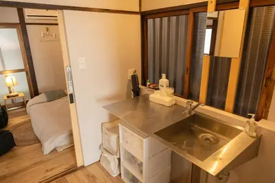 a kitchen with a stainless steel sink in a room at Roopt\u795e\u697d\u5742 in Tokyo