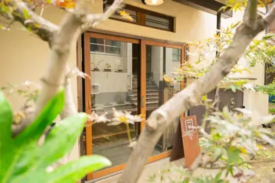 a sliding glass door of a house with flowers at Roopt\u795e\u697d\u5742 in Tokyo