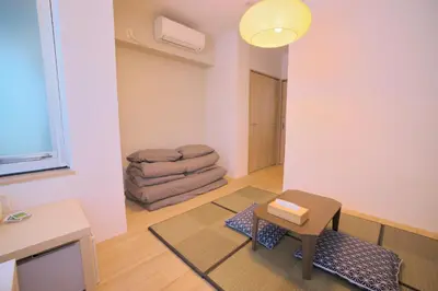 a living room with a table and a chair at Kyo-wa Hotel in Tokyo