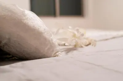 a close up of a pillow on a bed at \u5168\u65b0\u4e09\u4e4b\u8f6e\u4e00\u6237\u5efab\u680b in Tokyo