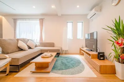 a living room with a couch and a tv at \u5168\u65b0\u4e09\u4e4b\u8f6e\u4e00\u6237\u5efab\u680b in Tokyo