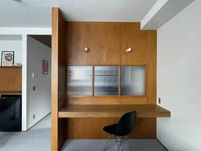 a room with a window and a black chair at NO SERVICE HOTEL asakusa in Tokyo