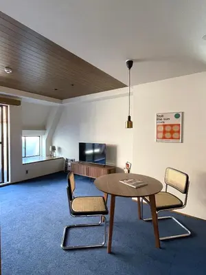 a living room with a table and two chairs at NO SERVICE HOTEL asakusa in Tokyo