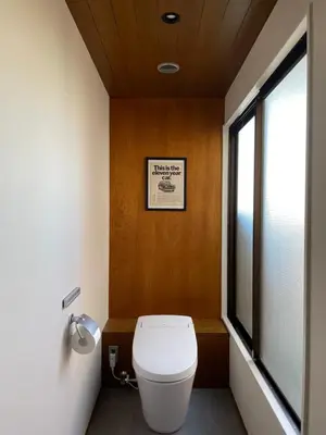 a bathroom with a toilet and a window at NO SERVICE HOTEL asakusa in Tokyo