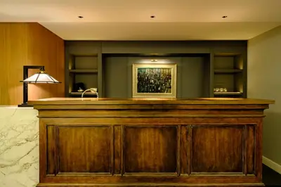 a bar in a hotel room with a counter at Roppongi House by U - Designers room - Steps to Roppongi Hills & Nightlife in Tokyo