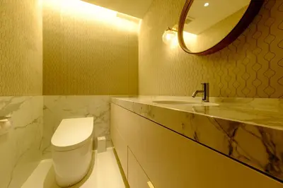 a bathroom with a toilet and a sink and a mirror at Roppongi House by U - Designers room - Steps to Roppongi Hills & Nightlife in Tokyo