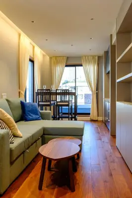 a living room with a couch and a table at Roppongi House by U - Designers room - Steps to Roppongi Hills & Nightlife in Tokyo