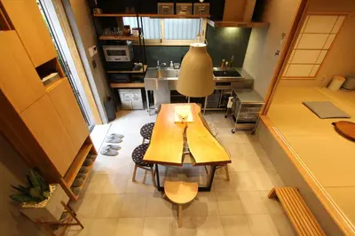 a small kitchen with a wooden table in a room at Tokyo Villa Kameido in Tokyo