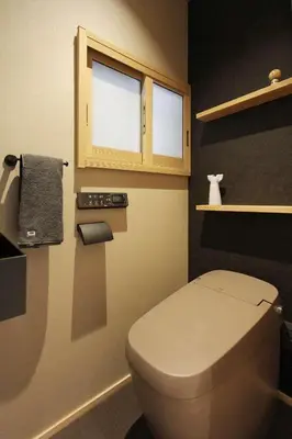 a small bathroom with a toilet and a window at Tokyo Villa Kameido in Tokyo