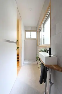 a bathroom with a white sink and a window at Tokyo Villa Kameido in Tokyo