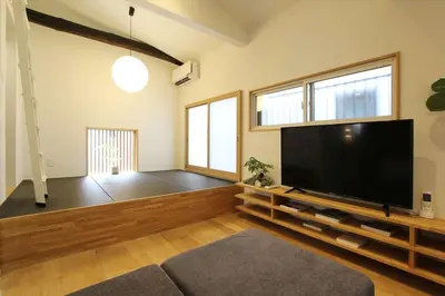 a living room with a large flat screen tv at Tokyo Villa Kameido in Tokyo