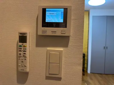 a wall with a tv and a remote control at YIYou Japan\u79cb\u8449\u539f301 in Tokyo