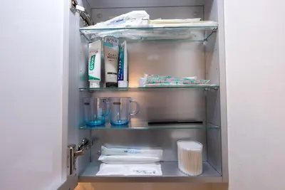 an open refrigerator door with towels and utensils at YIYou Japan\u79cb\u8449\u539f301 in Tokyo