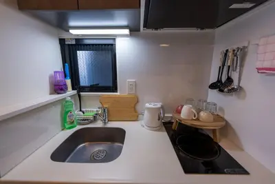 a kitchen with a sink and a counter top at YIYou Japan\u79cb\u8449\u539f301 in Tokyo
