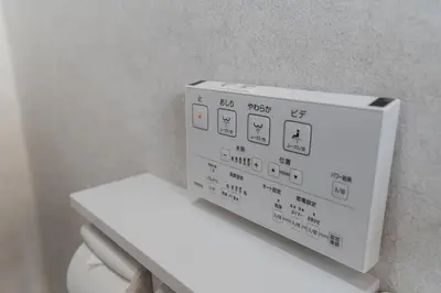 a white box on top of a toilet in a bathroom at Guesthouse Akasaka in Tokyo