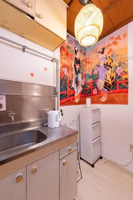 a kitchen with a sink and a painting on the wall at B 3rooms MAX10people 6min Shinjuku 11min Shibuya 12min walk Ikebukuro LEON RESORT IKEBUKURO traditional Japanese room \u6c60\u888b \u6700\u592710\u540d in Tokyo