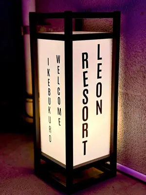 a black and white light with the words returnonics on it at B 3rooms MAX10people 6min Shinjuku 11min Shibuya 12min walk Ikebukuro LEON RESORT IKEBUKURO traditional Japanese room \u6c60\u888b \u6700\u592710\u540d in Tokyo
