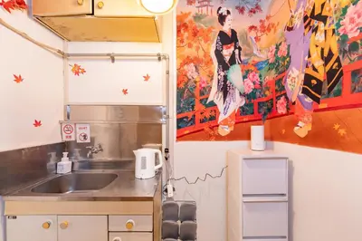 a kitchen with a sink and a painting on the wall at B 3rooms MAX10people 6min Shinjuku 11min Shibuya 12min walk Ikebukuro LEON RESORT IKEBUKURO traditional Japanese room \u6c60\u888b \u6700\u592710\u540d in Tokyo
