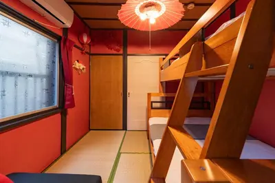 a room with bunk beds and a staircase with a light at B 3rooms MAX10people 6min Shinjuku 11min Shibuya 12min walk Ikebukuro LEON RESORT IKEBUKURO traditional Japanese room \u6c60\u888b \u6700\u592710\u540d in Tokyo
