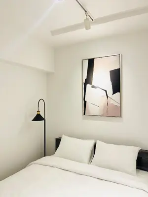 a bedroom with a white bed with a black lamp at Alo BnB 9 - Near ROPPONGI, GINZA, SHINJUKU, SHIBUYA - Self check-in in Tokyo
