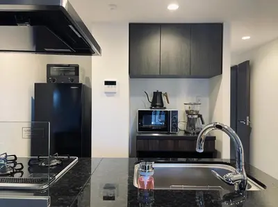 a kitchen with a sink and a microwave at Alo BnB 9 - Near ROPPONGI, GINZA, SHINJUKU, SHIBUYA - Self check-in in Tokyo