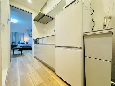 a kitchen with white appliances and wooden floors at Shinjuku Kabukichō-4F-SJ0013 in Tokyo