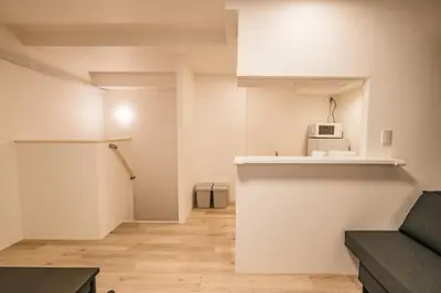a living room with a couch and a microwave at Apb \u4e24\u56fd in Tokyo