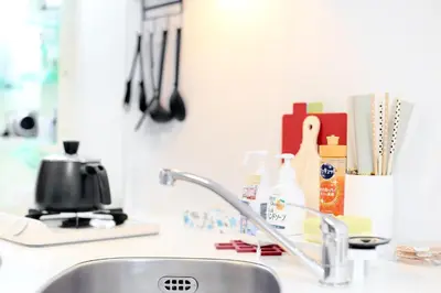 a kitchen sink with a faucet and a counter top at Luna House in Tokyo