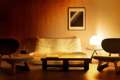 a bedroom with a bed with a table and two chairs at Zen apartment in central Tokyo in Tokyo