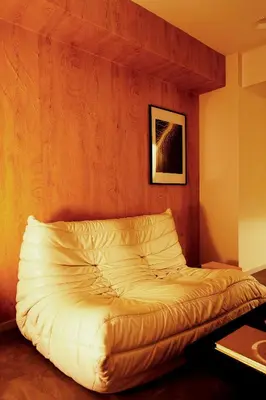 a bed in the corner of a room at Zen apartment in central Tokyo in Tokyo
