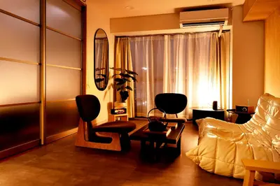 a living room with a couch and a chair at Zen apartment in central Tokyo in Tokyo