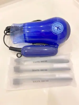 a blue phone sitting on top of four white markers at Pangoo Shinagawa Room 104 - Vacation STAY 97800v in Tokyo