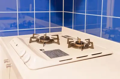 a white stove top with two burners on it at Pangoo Shinagawa Room 104 - Vacation STAY 97800v in Tokyo