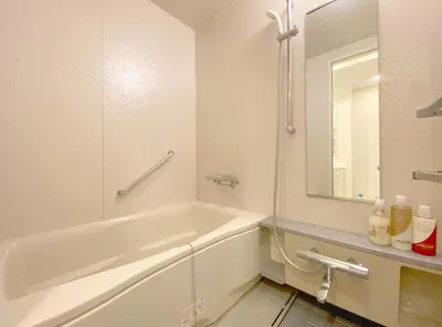 a white bathroom with a tub and a mirror at Pangoo Shinagawa Room 201 - Vacation STAY 98556v in Tokyo