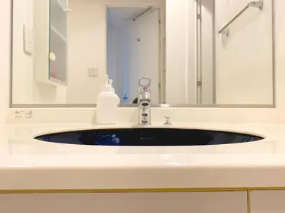 a bathroom sink with a mirror and a soap dispenser at Pangoo Shinagawa Room 201 - Vacation STAY 98556v in Tokyo