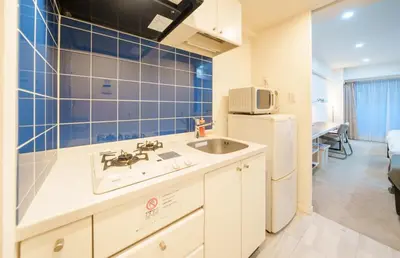 a kitchen with a sink and a refrigerator at Pangoo Shinagawa Room 202 - Vacation STAY 98591v in Tokyo