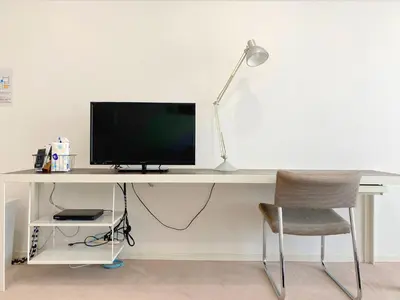 a white desk with a monitor and a chair at Pangoo Shinagawa Room 202 - Vacation STAY 98591v in Tokyo