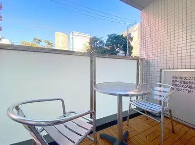 a table and two chairs on a balcony at Pangoo Shinagawa Room 204 - Vacation STAY 98612v in Tokyo