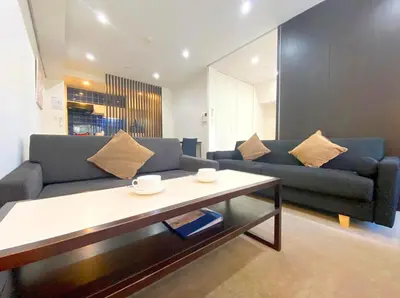 a living room with a couch and a coffee table at Pangoo Shinagawa Room 204 - Vacation STAY 98612v in Tokyo
