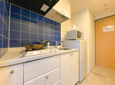 a kitchen with a sink and a refrigerator at Pangoo Shinagawa Room 303 - Vacation STAY 99296v in Tokyo