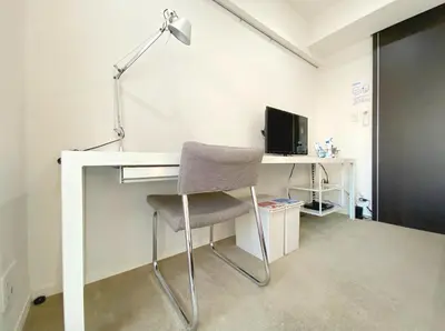 a desk with a chair and a desk with a computer at Pangoo Shinagawa Room 303 - Vacation STAY 99296v in Tokyo