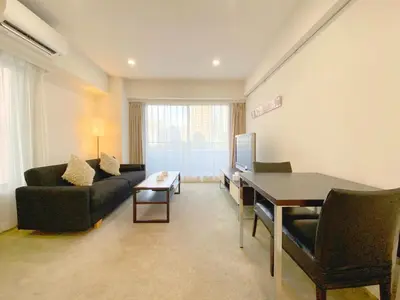 a living room with a couch and a table at Pangoo Shinagawa Room 304 - Vacation STAY 18366 in Tokyo